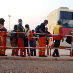 Industrial mine workers waiting for the company bus DRC