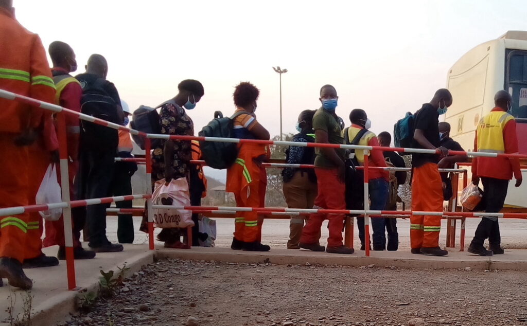 Industrial mine workers waiting for the company bus_DRC_cropped__