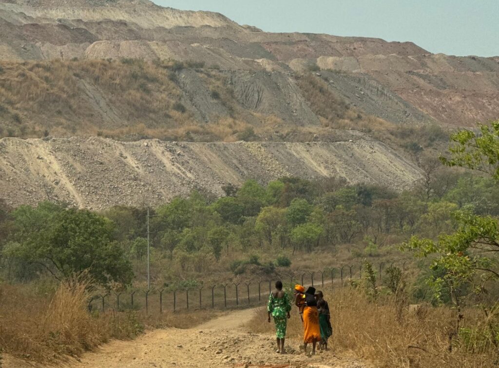 Body_Women Walking Near Mine Road_DRC_Scientific_